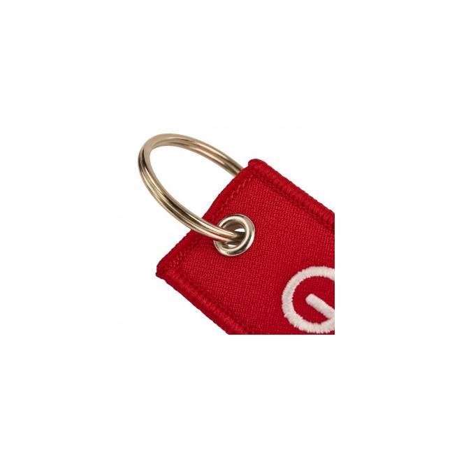 Sleutelhanger in vlamvorm GTECHNIQ van stof.