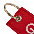 Sleutelhanger in vlamvorm GTECHNIQ van stof.
